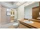Bathroom with a sink, toilet, and shower with glass doors at 56 Bay Woods Dr, Safety Harbor, FL 34695