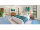 Comfortable bedroom with coordinated decor, including a bed, dresser, and serene wall art at 56 Bay Woods Dr, Safety Harbor, FL 34695
