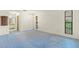 Bedroom space with natural light, neutral walls, and a glimpse into the en-suite bathroom at 56 Bay Woods Dr, Safety Harbor, FL 34695