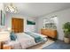 Bedroom with a queen bed, a window, dresser, and plants at 56 Bay Woods Dr, Safety Harbor, FL 34695