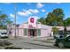 Eye-catching art deco-style building with unique architectural details and vibrant pink facade at 56 Bay Woods Dr, Safety Harbor, FL 34695