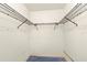 Walk-in closet with installed wire shelving and blue carpet at 56 Bay Woods Dr, Safety Harbor, FL 34695