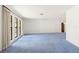 Bright living room with large windows and neutral walls offering a versatile space at 56 Bay Woods Dr, Safety Harbor, FL 34695