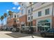 Commercial buildings with retail and restaurants on a tree lined street, with parking out front at 56 Bay Woods Dr, Safety Harbor, FL 34695