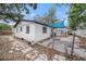 Backyard features a concrete patio shaded by mature trees at 5801 92Nd N Ave, Pinellas Park, FL 33782