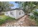 Backyard features mature trees and landscaping at 5801 92Nd N Ave, Pinellas Park, FL 33782