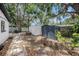 Backyard with storage sheds and mature trees at 5801 92Nd N Ave, Pinellas Park, FL 33782