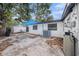 View of backyard with concrete patio, storage, and mature shade trees at 5801 92Nd N Ave, Pinellas Park, FL 33782