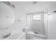 Modern bathroom featuring an updated vanity, toilet and shower with marbled walls at 5801 92Nd N Ave, Pinellas Park, FL 33782