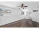 Bedroom featuring hardwood floors, neutral walls, ceiling fan and an attached bathroom at 5801 92Nd N Ave, Pinellas Park, FL 33782