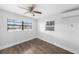This bedroom features hardwood floors, neutral walls, ceiling fan and lots of natural light at 5801 92Nd N Ave, Pinellas Park, FL 33782