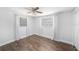 Bedroom featuring hardwood floors, neutral walls, ceiling fan, and lots of natural light at 5801 92Nd N Ave, Pinellas Park, FL 33782