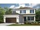 Charming two-story home featuring a neutral color palette, well-manicured lawn, and a two-car garage at 714 Sky Shade Dr, Apollo Beach, FL 33572