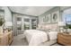 Serene main bedroom with soft colors, large windows, and neutral decor at 714 Sky Shade Dr, Apollo Beach, FL 33572