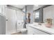 Well-lit bathroom with a glass-enclosed shower, white vanity with sink, and neutral wall color offering modern elegance at 727 Steel Dr, Apollo Beach, FL 33572