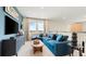 Upstairs bonus room with a comfortable sectional and mounted TV at 727 Steel Dr, Apollo Beach, FL 33572
