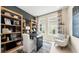 Cozy home office featuring stylish desk, shelving, and ample natural light at 727 Steel Dr, Apollo Beach, FL 33572
