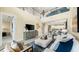 Open-concept living room boasts soaring ceilings and seamless flow to kitchen and dining areas at 727 Steel Dr, Apollo Beach, FL 33572