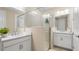 Bright main bathroom with double vanity sinks and glass shower at 727 Steel Dr, Apollo Beach, FL 33572