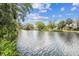 Scenic view of the waterway, showing a wide expanse of calm water and lush greenery on the banks at 7300 Mackerel Ln, Hudson, FL 34667