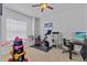 Bright exercise room with workout equipment and a window seat for relaxing at 7309 S Shamrock Rd, Tampa, FL 33616