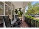 Inviting front porch featuring classic rocking chairs and stylish decor, perfect for relaxing outdoors at 7309 S Shamrock Rd, Tampa, FL 33616