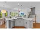 Bright and airy open concept kitchen with stainless steel appliances and natural light at 7309 S Shamrock Rd, Tampa, FL 33616