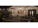 A beautifully landscaped patio with string lights, outdoor furniture, and a dining area at 7309 S Shamrock Rd, Tampa, FL 33616