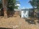 Spacious backyard with a storage shed and mature landscaping and a fence at 7631 43Rd St N, Pinellas Park, FL 33781