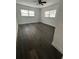 Spacious bedroom with two windows and wood-look flooring at 7631 43Rd St N, Pinellas Park, FL 33781