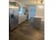 Updated kitchen with stainless steel refrigerator and light gray cabinets at 7631 43Rd St N, Pinellas Park, FL 33781