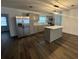 Modern kitchen boasts stainless steel appliances, island and light gray cabinets at 7631 43Rd St N, Pinellas Park, FL 33781
