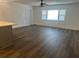 Bright living room featuring new hard wood floors and an updated ceiling fan at 7631 43Rd St N, Pinellas Park, FL 33781