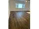 Open living area with hard flooring and bright natural light at 7631 43Rd St N, Pinellas Park, FL 33781