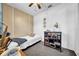 Cozy bedroom featuring neutral tones, ceiling fan, and unique dresser at 7850 40Th N Ave # 7850, St Petersburg, FL 33709