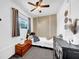 Cozy bedroom featuring a ceiling fan and neutral decor elements at 7850 40Th N Ave # 7850, St Petersburg, FL 33709
