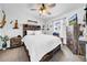 Cozy bedroom features rustic wood accents and a ceiling fan for added comfort at 7850 40Th N Ave # 7850, St Petersburg, FL 33709