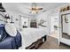 Comfortable bedroom with ceiling fan, natural light, and access to the en-suite bathroom at 7850 40Th N Ave # 7850, St Petersburg, FL 33709