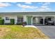 Charming home featuring a well-maintained lawn, covered parking, and a quaint entrance at 7850 40Th N Ave # 7850, St Petersburg, FL 33709