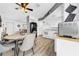 Open kitchen and dining area with a ceiling fan and stainless steel appliances at 7850 40Th N Ave # 7850, St Petersburg, FL 33709