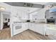 Bright kitchen features white cabinetry, tile backsplash, and stainless steel appliances at 7850 40Th N Ave # 7850, St Petersburg, FL 33709