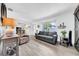 Bright living room with plank floors, plush furnishings, and natural light at 7850 40Th N Ave # 7850, St Petersburg, FL 33709