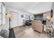 Bright living room with plank floors, barn door accent, and comfortable seating at 7850 40Th N Ave # 7850, St Petersburg, FL 33709
