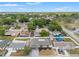 Aerial view of the property highlighting its location in a quiet neighborhood with mature trees and well-kept homes at 8010 Chickasaw Ln, Port Richey, FL 34668