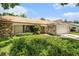 This cozy single Gathering home has stone accents, a well manicured front lawn, and a two car garage at 8105 Valley Stream Ln, Hudson, FL 34667