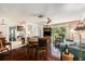 Open-concept living area featuring wood floors, comfortable seating, and easy access to the kitchen at 8105 Valley Stream Ln, Hudson, FL 34667