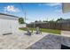 Backyard with paver patio area and a well-maintained lawn, ideal for entertaining or relaxation at 812 60Th S St, Gulfport, FL 33707