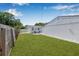 Lush green backyard with a paved patio area perfect for outdoor seating and relaxation at 812 60Th S St, Gulfport, FL 33707