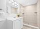 Well-lit bathroom with sleek vanity, updated fixtures, and a glass-enclosed shower at 812 60Th S St, Gulfport, FL 33707