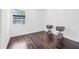 Cozy bedroom with hardwood floors and a large window providing plenty of natural light at 812 60Th S St, Gulfport, FL 33707